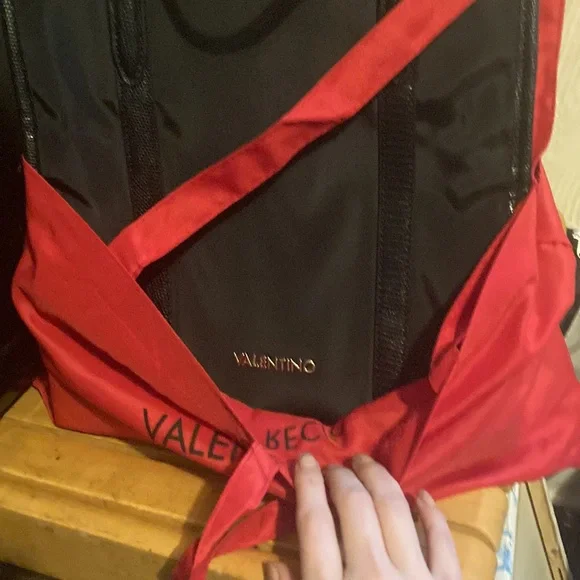 Mario Valentino used one time